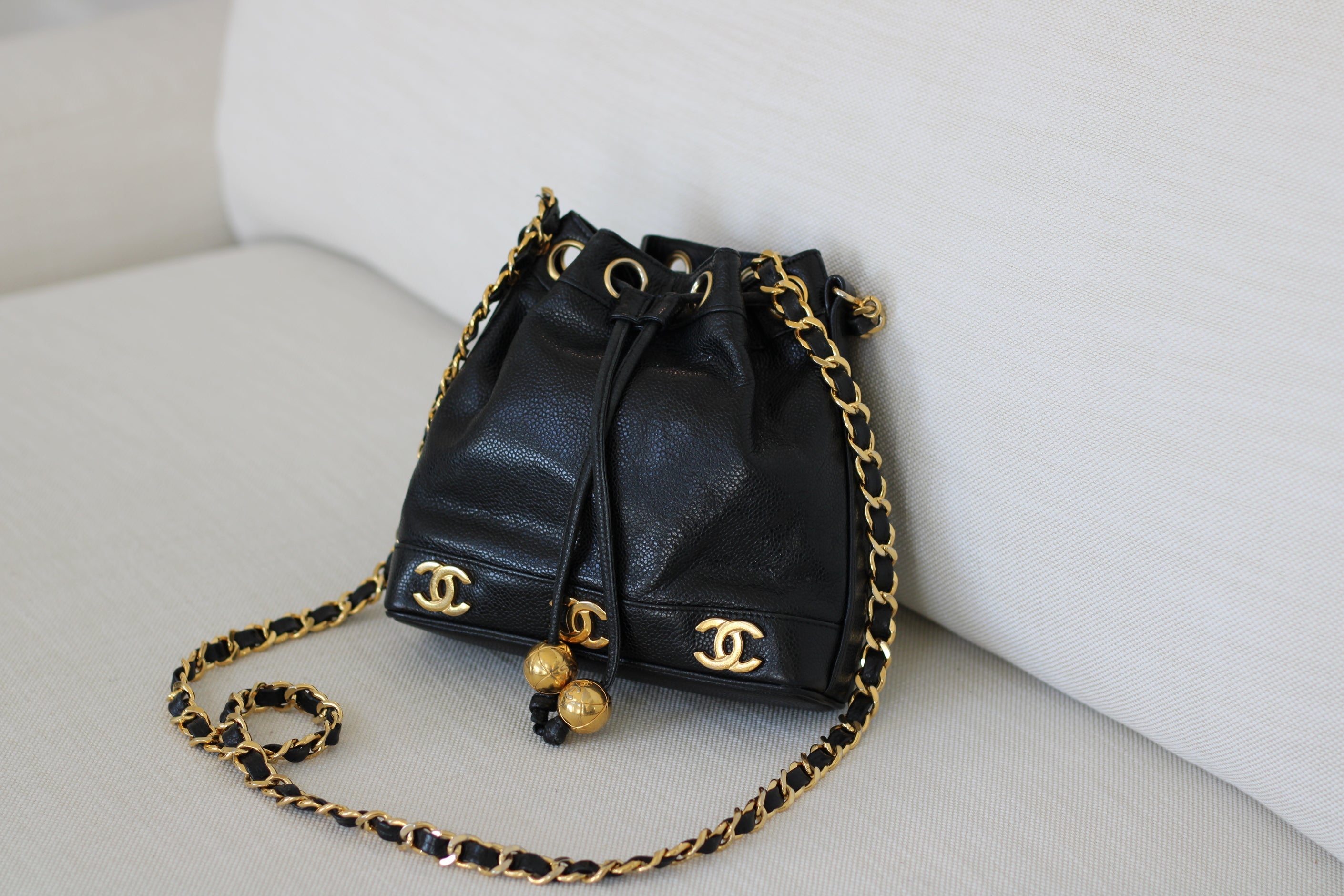 preloved luxury handbag by Chanel in black with gold gilding