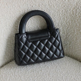 Chanel Black Calfskin Nano Kelly Top Handle with Aged Gold Hardware