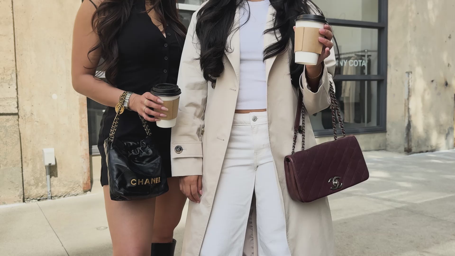 Used luxury handbags by Chanel being carried around the city by two stylish women